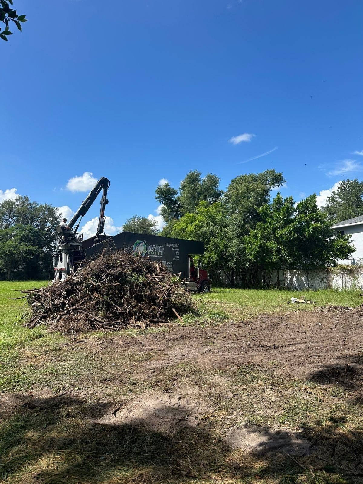 Grapple truck pickup — H&M Tree Service, Tampa